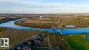 Riverfront property featuring a bridge, golf course, and natural landscape - 16607 8 Street, Edmonton, AB 