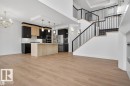 Open-concept living area featuring wood-finish flooring throughout - 19 Rosa Crescent, St. Albert, AB 
