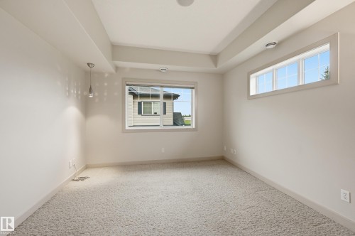 Tray ceiling featuring recessed lighting and a central ceiling speaker - 50 2565 Hanna Crescent, Edmonton, AB 