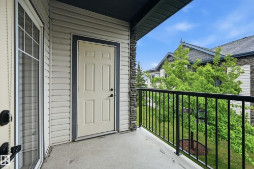 Private balcony featuring a concrete floor, black metal railing, and horizontal siding - 50 2565 Hanna Crescent, Edmonton, AB 