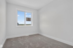 Neutral wall colors with white trim and grey carpeting - 