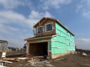 New construction home featuring a two-story design, attached garage, and multiple window openings - 84 Rosa Crescent, St. Albert, AB 