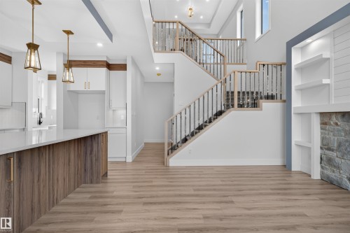 Open-concept living space with wood-finish flooring - 84 Rosa Crescent, St. Albert, AB - Indoor Photo Showing Other Room