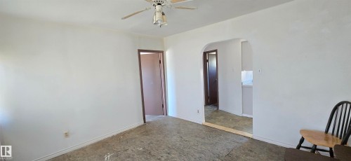Bright interior space featuring white walls and a ceiling fan - Vegreville, AB - Indoor Photo Showing Other Room
