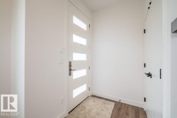 Modern entry door with horizontal frosted glass inserts and brushed nickel hardware - 