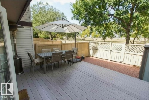 Spacious outdoor deck featuring light-toned composite decking - 14648 54 Street, Edmonton, AB 
