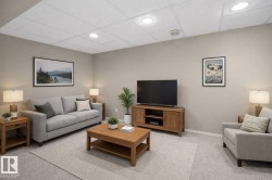 Finished room with light grey wall paint and light-colored carpeting - 
