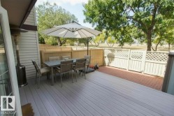 Spacious outdoor deck featuring light-toned composite decking - 