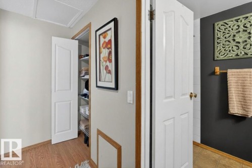 Interior hallway with wood-finish flooring - 14648 54 Street, Edmonton, AB 