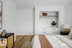 Built-in closet system featuring integrated drawers and hanging rod - 