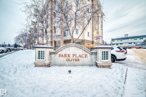 Stone monument signage featuring "PARK PLACE OLIVER" with integrated glass block details - 108 10535 122 Street, Edmonton, AB 