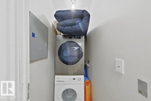 Dedicated laundry area featuring a stacked washer and dryer - 218 5065 31 Avenue, Edmonton, AB 