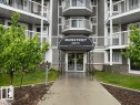 Multi-story building exterior featuring gray siding and white trim - 218 5065 31 Avenue, Edmonton, AB 