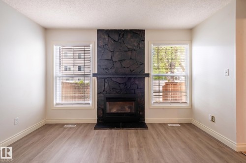 18439 66 Avenue, Edmonton, AB - Indoor Photo Showing Living Room With Fireplace