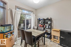 Dining area featuring a sliding glass door providing direct access to an outdoor deck - 