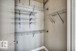 Closet interior featuring multiple levels of wire shelving and integrated hanging rods - 