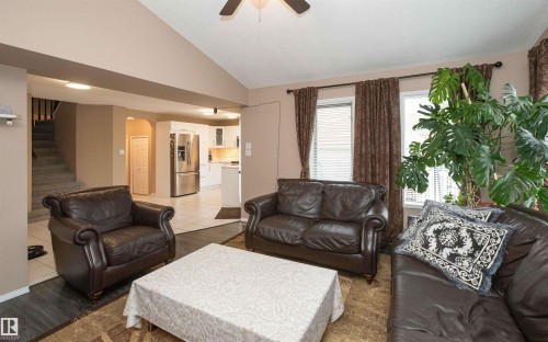Vaulted ceiling with a ceiling fan, recessed lighting, and wood-finish flooring - 10739 109 Avenue, Westlock, AB 