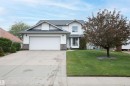 Two-story residence featuring white siding, a two-car garage, and a covered entry - 10739 109 Avenue, Westlock, AB 