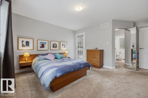 Notice the access to the organized W/I closet, renovated ensuite and the door to your private balcony offering fantastic views of the neighborhood and your lovely yard - 31 Wentworth Crescent, St. Albert, AB - Indoor Photo Showing Bedroom