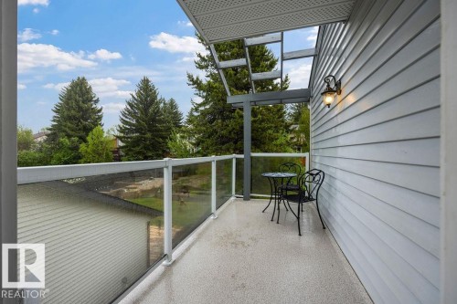 Your balcony off the primary bedroom boasts fantastic views and features vinyl covered decking and glass panel railings - 31 Wentworth Crescent, St. Albert, AB - Outdoor With Balcony With Exterior