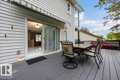 Expansive outdoor 2-tier deck featuring newer composite decking and a retractable awning - 31 Wentworth Crescent, St. Albert, AB - Outdoor With Deck Patio Veranda With Exterior
