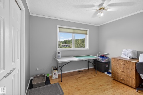 Room featuring light wood-finish flooring and a neutral wall color - 110 52308 Rr 214, Rural Strathcona County, AB 