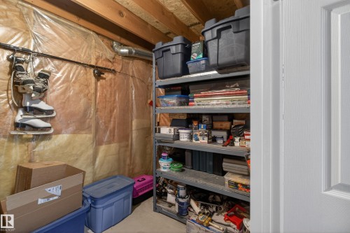Unfinished basement area featuring exposed wood ceiling joists and foil-faced insulation - 110 52308 Rr 214, Rural Strathcona County, AB 
