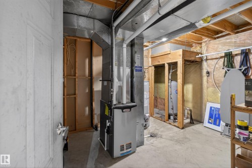 Basement utility area featuring exposed wood joists and concrete flooring - 110 52308 Rr 214, Rural Strathcona County, AB 