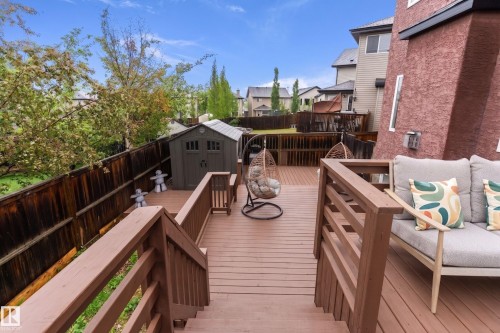 Multi-level deck featuring composite decking and wood railings - 16609 58A Street, Edmonton, AB 