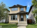 Two-story residence featuring light-colored horizontal siding and dark trim accents - 9432 211 Street, Edmonton, AB 