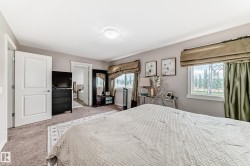 Carpeted bedroom featuring a neutral color palette and recessed lighting - 