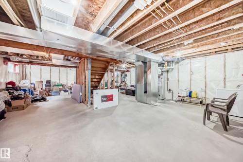 Unfinished basement with exposed wood joists and concrete flooring - 2808 36 Avenue, Edmonton, AB 