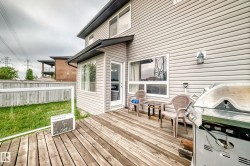 Wood-finish deck with a privacy fence - 