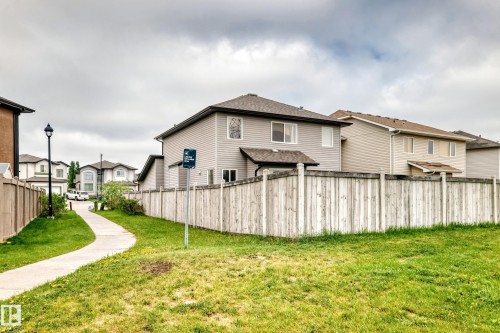 Two-story residential structure featuring light gray siding and a dark shingled roof - 2808 36 Avenue, Edmonton, AB 