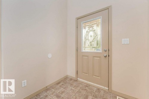 Front entry door featuring decorative glass insert - 16315 55 Street, Edmonton, AB 