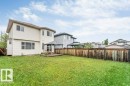 Expansive backyard with a large lawn area and wood privacy fencing - 16315 55 Street, Edmonton, AB 