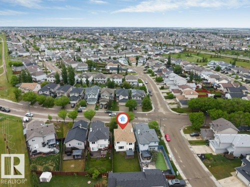Suburban neighborhood featuring a grid of residential streets and numerous single-family homes with pitched roofs - 16315 55 Street, Edmonton, AB 