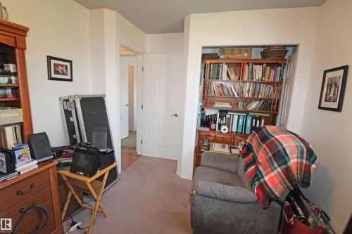 Built-in shelving unit with multiple tiers and base cabinetry - 334 7001 Northview Drive, Wetaskiwin, AB - Indoor