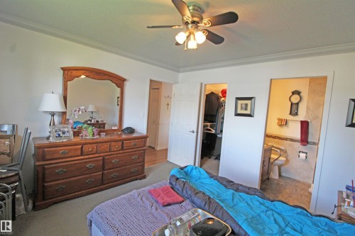 Interior room with crown molding and a ceiling fan - 334 7001 Northview Drive, Wetaskiwin, AB - Indoor Photo Showing Bedroom