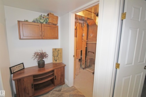 Utility space featuring exposed ductwork and plumbing - 334 7001 Northview Drive, Wetaskiwin, AB - Indoor Photo Showing Other Room