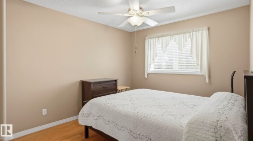 Neutral tone walls with white trim and wood-finish flooring - 856 Graham Wynd, Edmonton, AB 