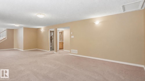 Expansive carpeted area with neutral wall tones - 856 Graham Wynd, Edmonton, AB 