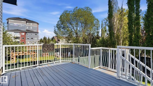 Outdoor deck featuring composite flooring and white railing system - 856 Graham Wynd, Edmonton, AB 