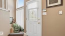 Entry door with decorative glass insert and brass hardware - 856 Graham Wynd, Edmonton, AB 