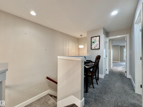 Upper level hallway featuring recessed lighting, a neutral color palette, and gray carpet flooring - 3254 Allan Way, Edmonton, AB 