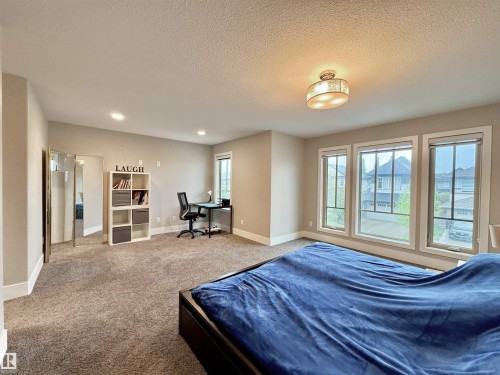 Spacious room with plush carpet flooring and a neutral wall palette - 3254 Allan Way, Edmonton, AB 