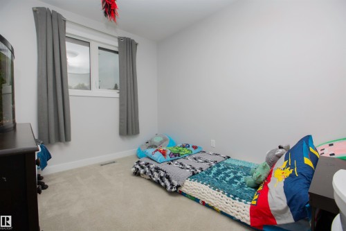 Light grey wall paint with coordinating light grey carpeting - 52 Mohawk Crescent, Leduc, AB 