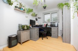 Light-toned wood-finish flooring complements the neutral wall color - 