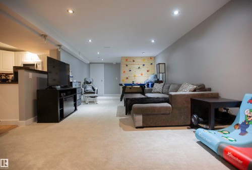 Spacious lower level featuring recessed lighting and neutral carpeting throughout - 52 Mohawk Crescent, Leduc, AB 