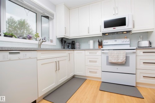White cabinetry with brushed nickel hardware - 52 Mohawk Crescent, Leduc, AB 